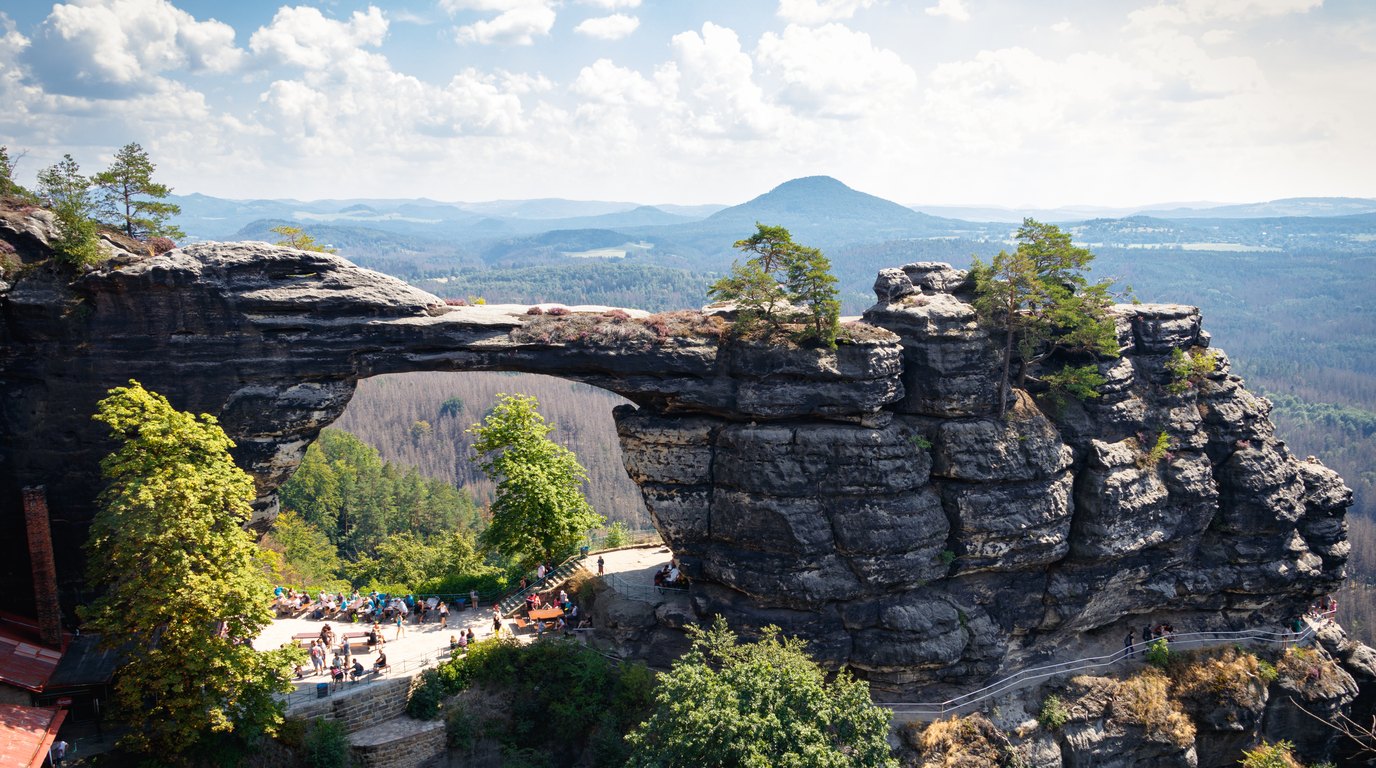 The sandstone arch of Pravčická brána above the wooded rocks of Bohemian Switzerland